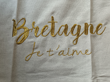 Preview: Baumwoll-Geschirrtuch mit bretonischer Flagge und liebevoller Stickerei